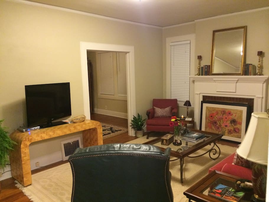 Livingroom, 9 foot ceilings, hardwood floors, comfortably furnished.