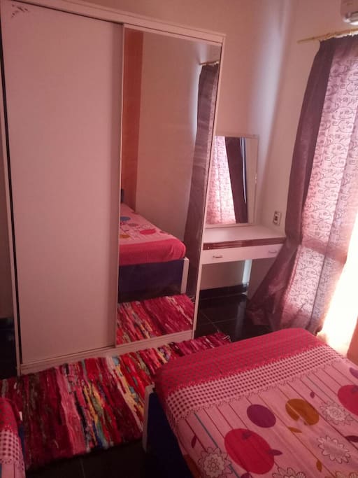 Bedroom with two beds, cupboard, mirror table, air-conditioned