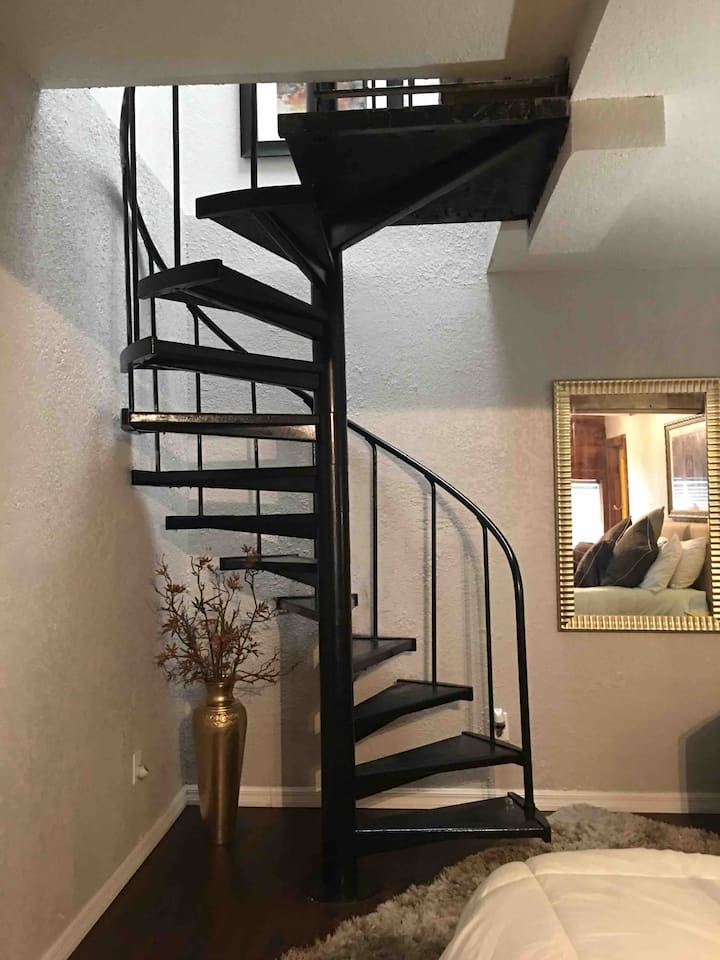 Spiral staircase top level living room kitchen and bath..

Lower level large  bedroom with king bed 