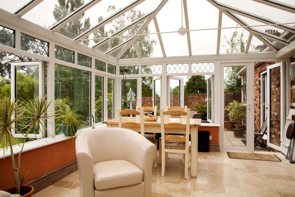 (Couches at the other end!) Come and have a something to drink with us in the conservatory on arrival