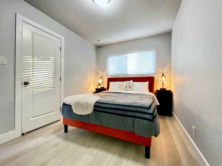 Bedroom 1: Queen bed, closet, USB charging lamps