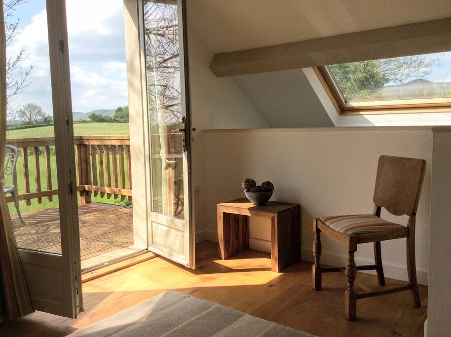 The extended bedroom offers an area to relax and enjoy the views
