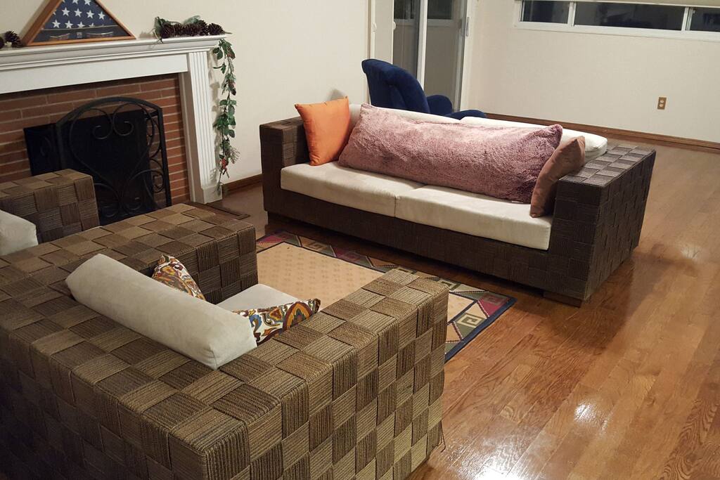Living room with sofas. Great for relaxing, cooking, and feeling at home. Space for air mattress as well.