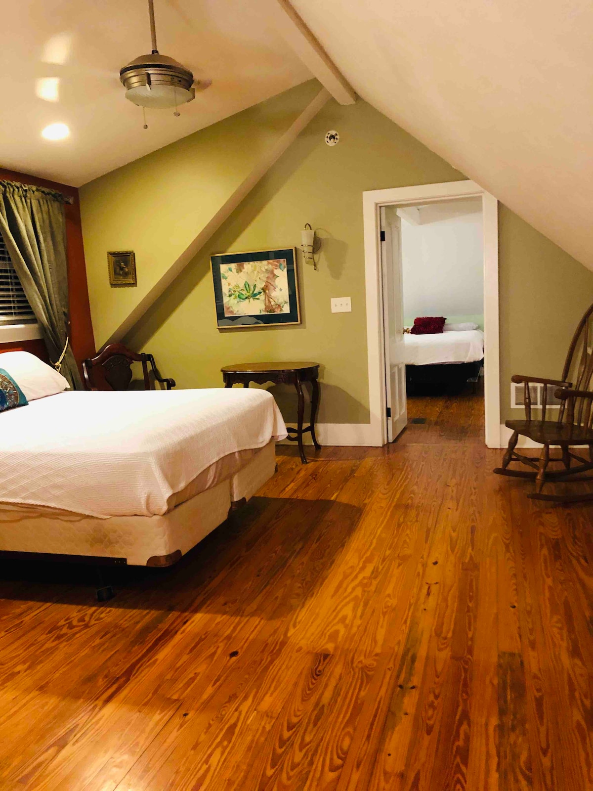 Master bedroom is complete with seating/dressing area.