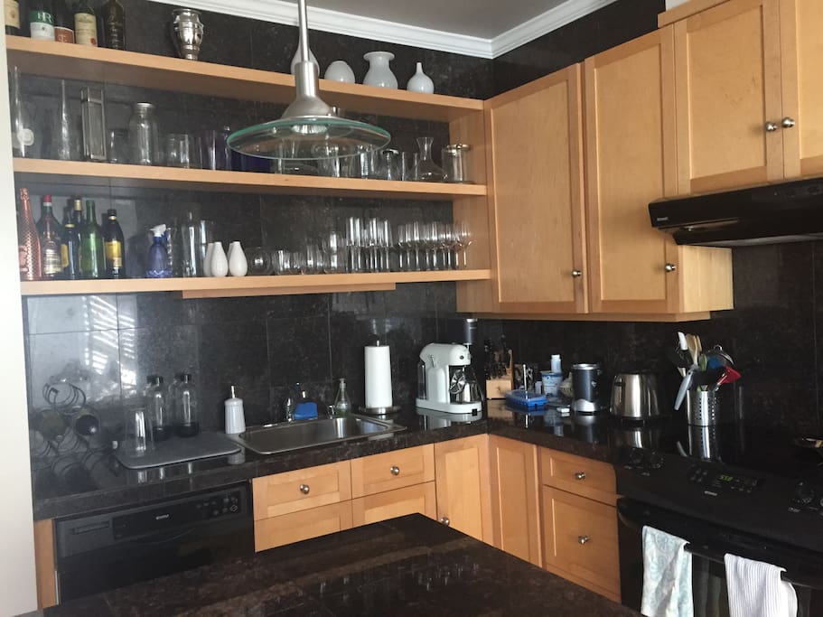 all granite, fully equipped kitchen with large island and seating for two