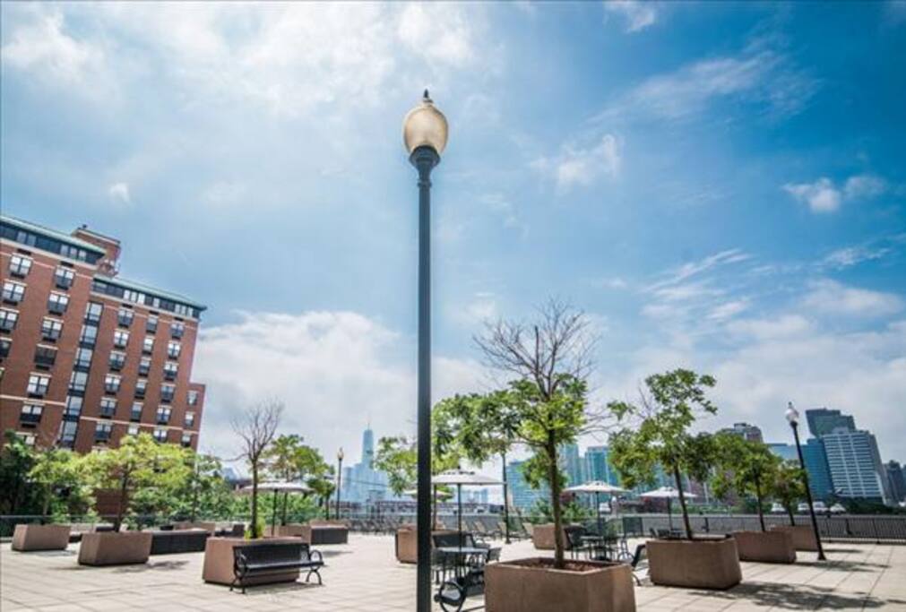 Deck has numerous chairs, tables and grills