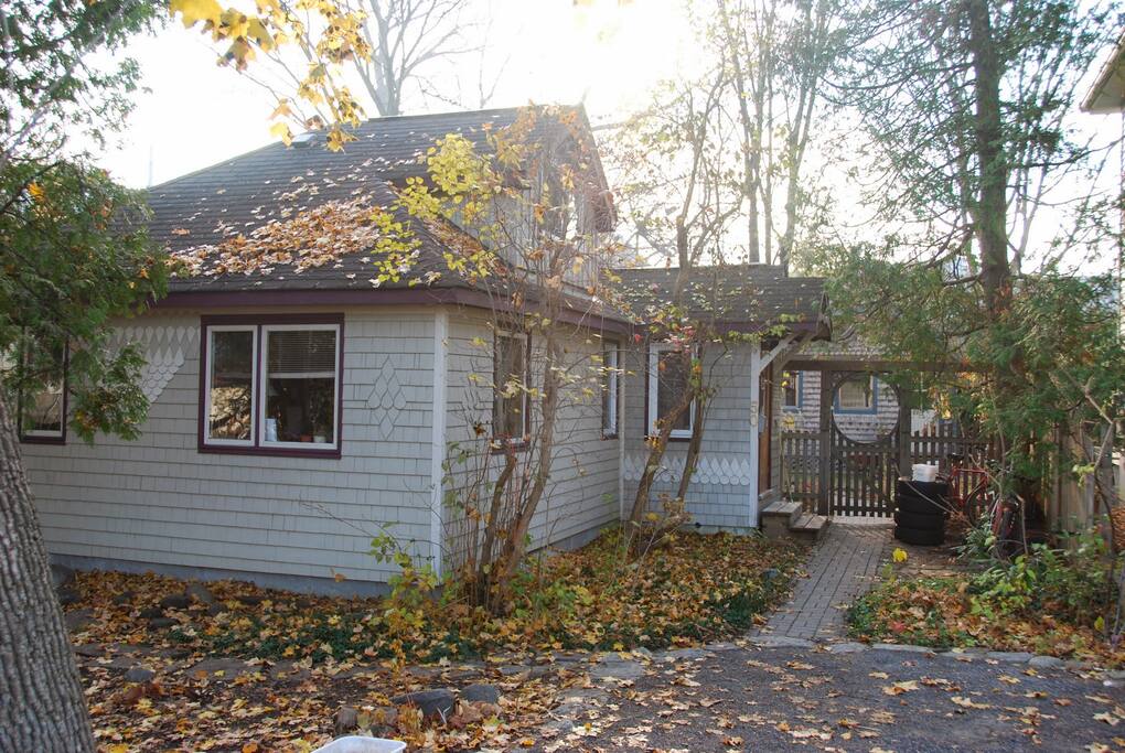 Cottage in the city exterior in autumn