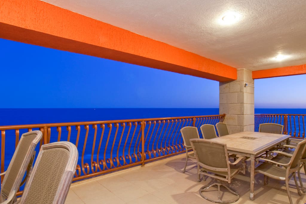 Patio with table to seat 8 and bar.