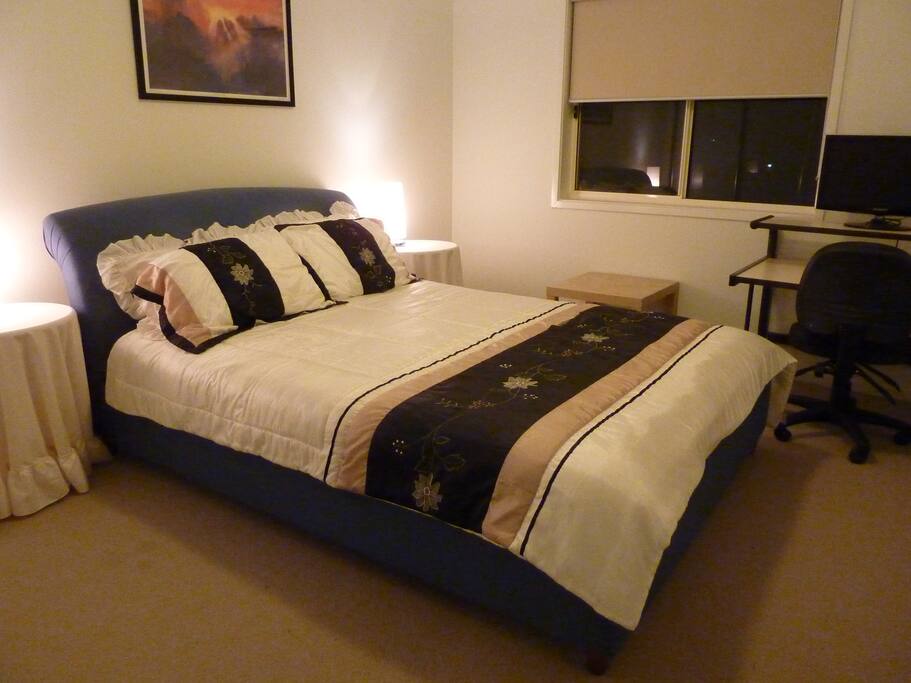 Bedroom with queen bed, built in wardrobe, study table suitable for a couple