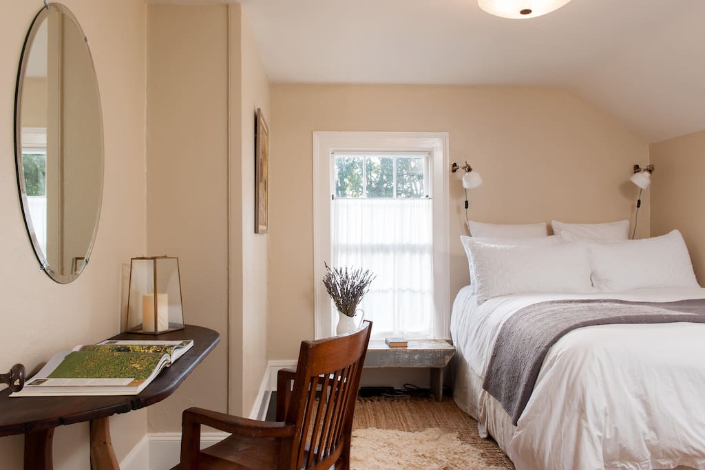 One of four bedrooms, all with queen beds, similarly furnished.