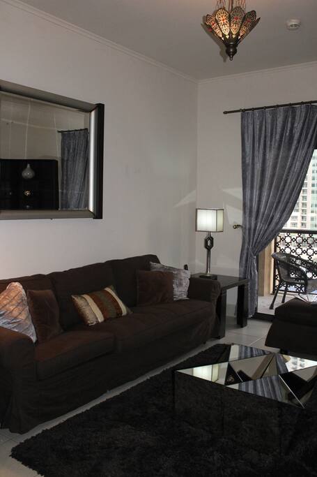 Living room with street view, balcony, smart TV, Wifi, cable TV