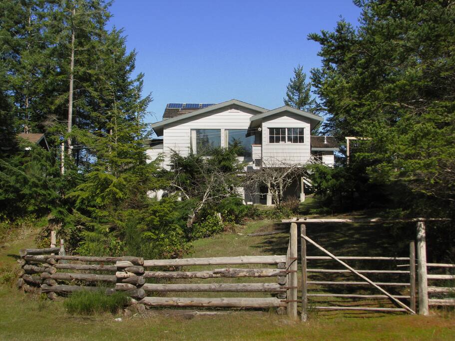 Upon arrival you will be greeted by this lovely view of the cabin across the grassy meadow.