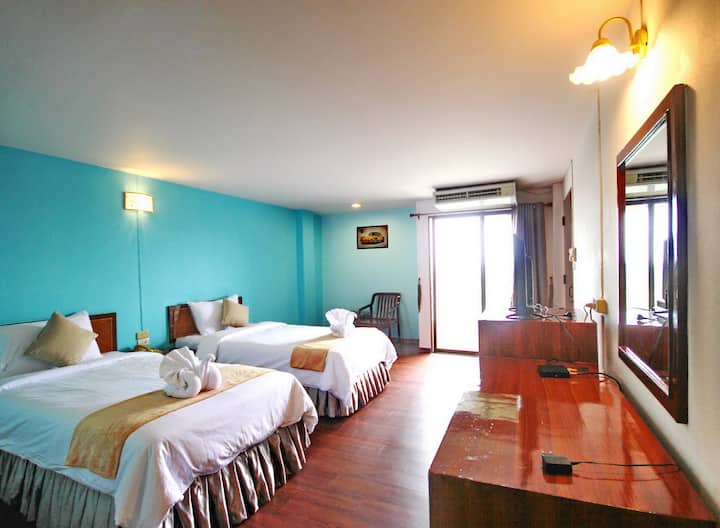 Our lovely twin-bedded room with complementary snack and mini-bars, free wifi, in-room food service, TV with many channels, mini-refridegator, air-con, working desk, balcony, private bathroom.
