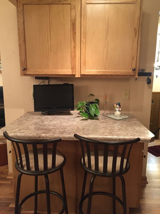 Breakfast bar/serving area in kitchen with TV