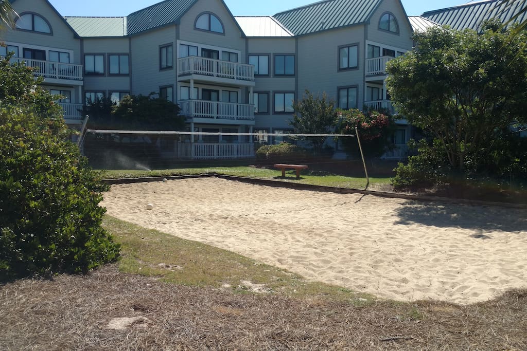 sand volley ball court right out the unit