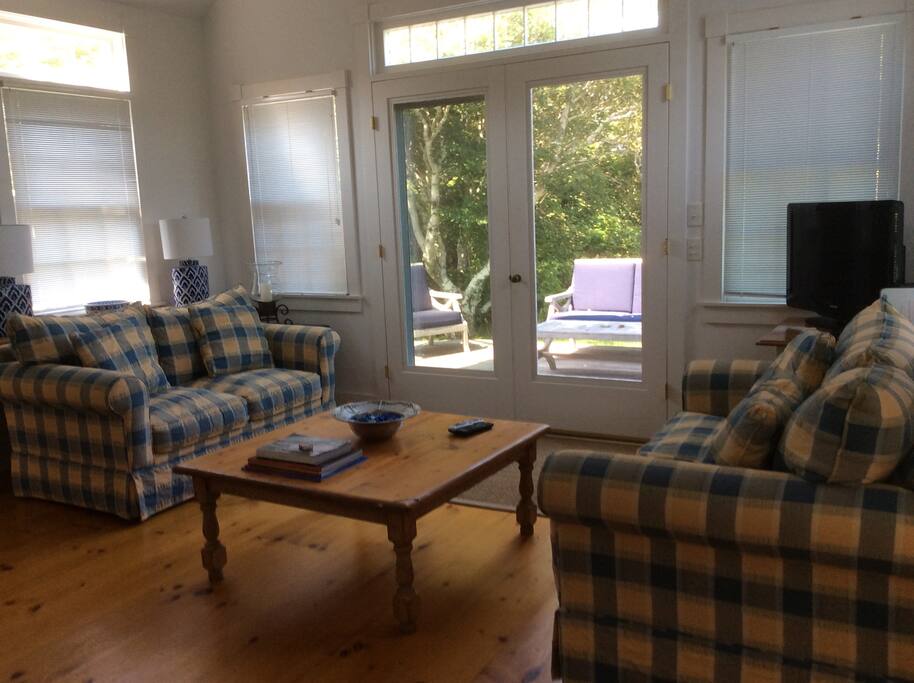 Living Room with Cathedral Ceiling andCable Television and Internet