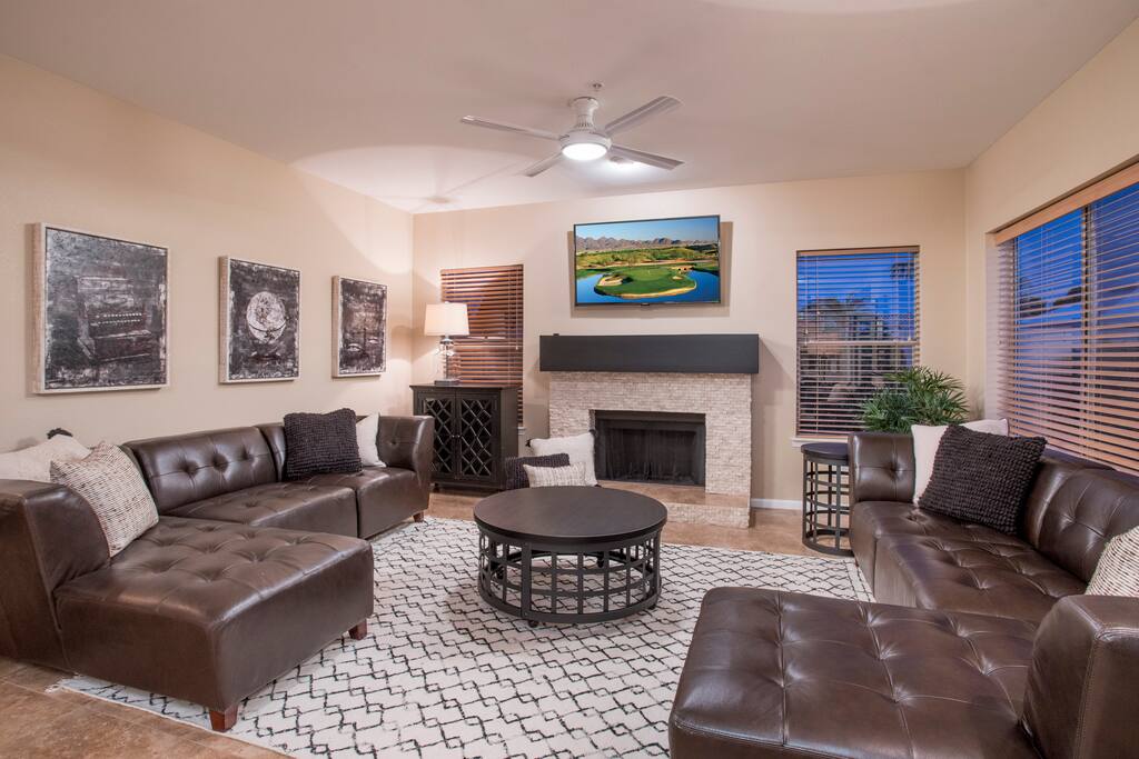 Family room with fireplace, TV and leather sectionals