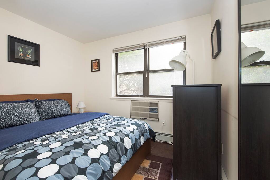 Bedroom 2 with queen-sized bed and great natural light (w/ curtains) for great sleep