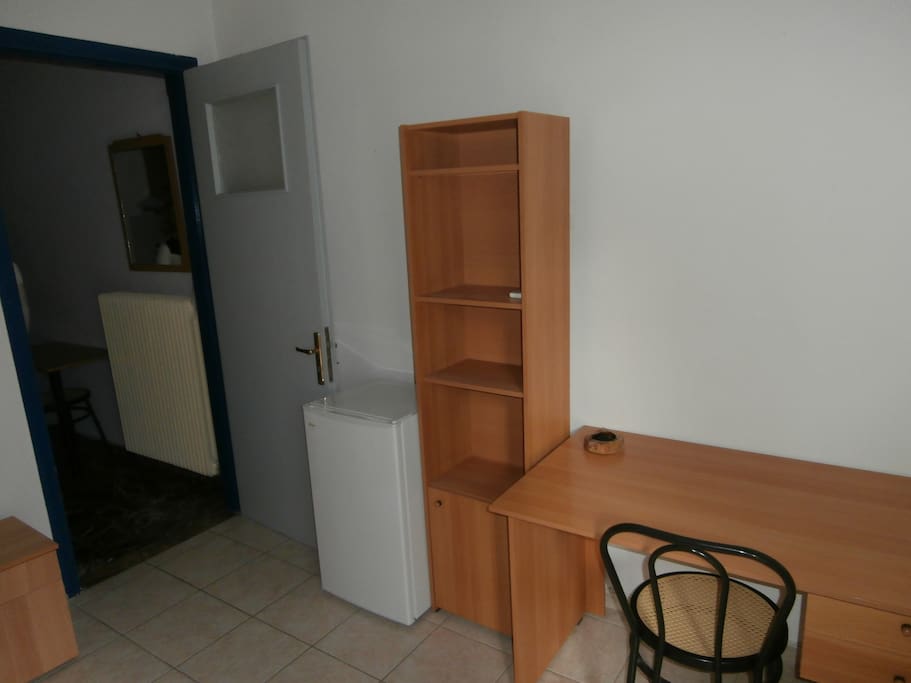 Feel free to use the desk and shelves, as well as the fridge of course.