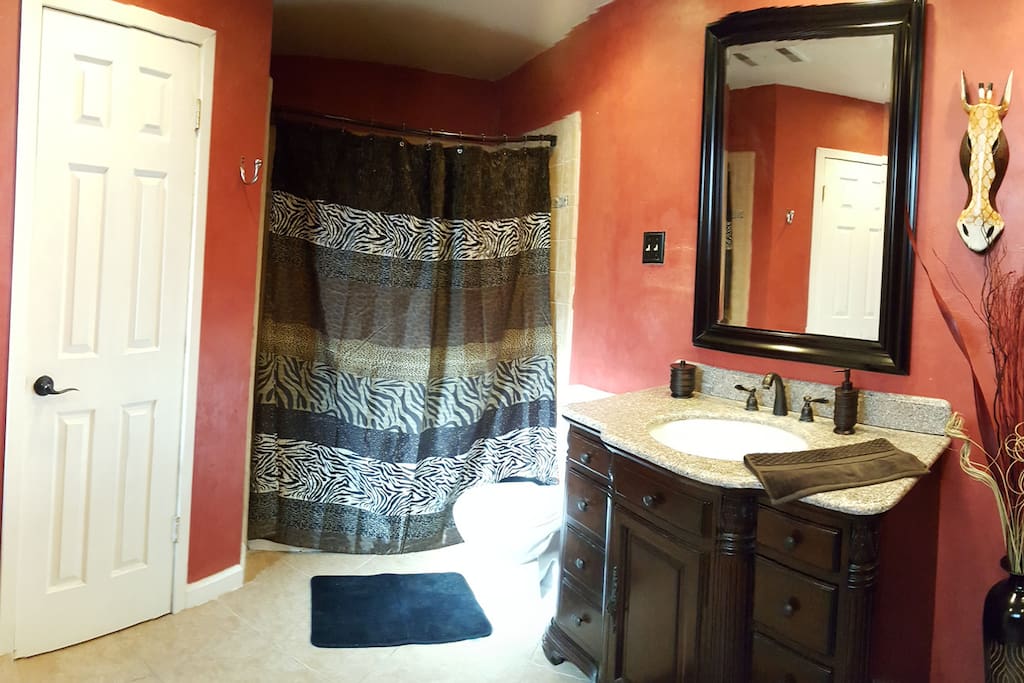 Master bathroom with double vanities and shower/ tub combination.