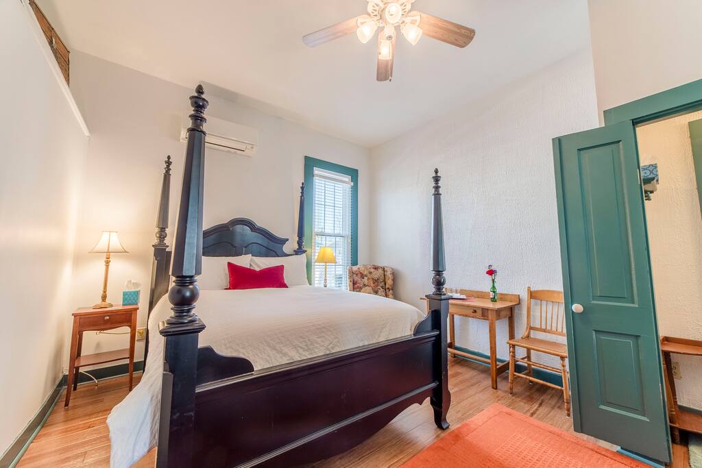 This spacious second floor rooms has high ceilings, charm, and all the comforts of home. Put your feet up while reclining and enjoy your favorite book.