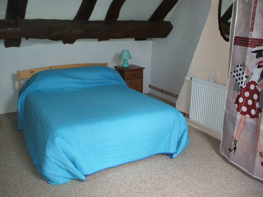 In the bedroom there is a double bed and a single bed.