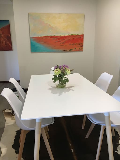 A well appointed central kitchen overlooks the light and bright dining area.
