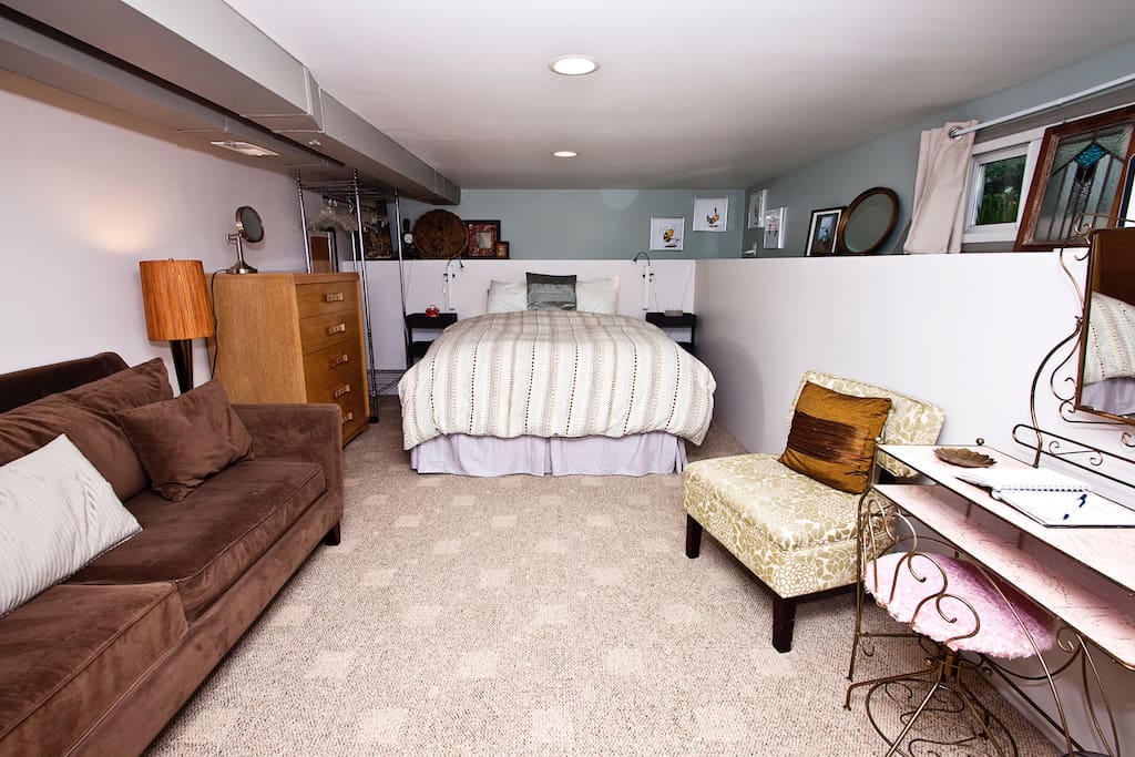 For guests who want to unpack their bags, the room also has a chest of drawers and a rack for hanging clothes.