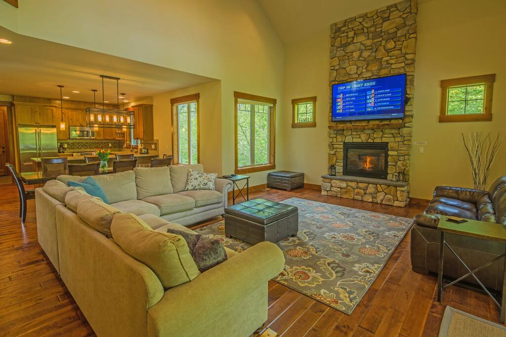 Fantastic great room with vaulted ceiling and a floor to ceiling ledgestone gas fireplace!