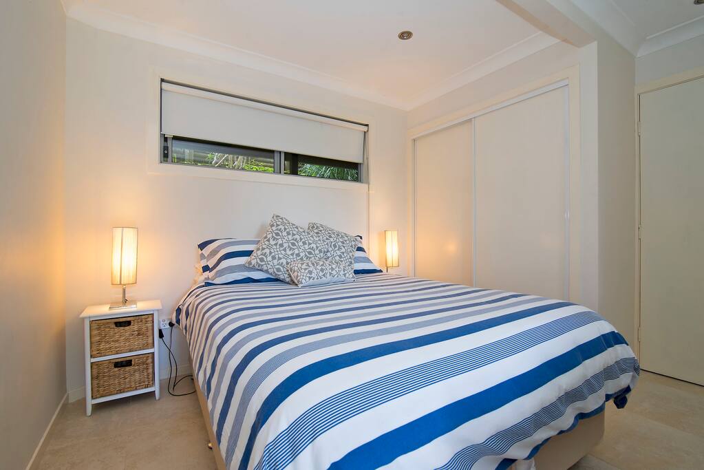 Very comfortable queen size bed with side tables, individual lamp and wardrobe