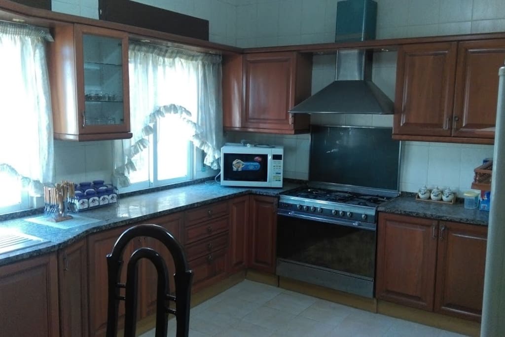 Spacious modern Oak kitchen with 24 ft frig.