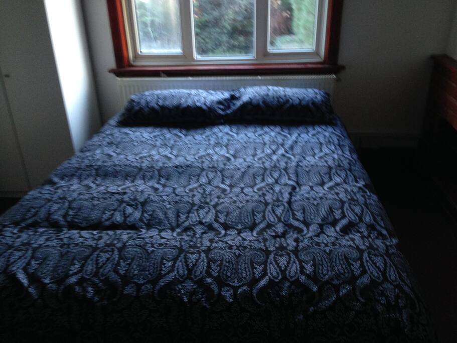 Large double bedroom with garden view