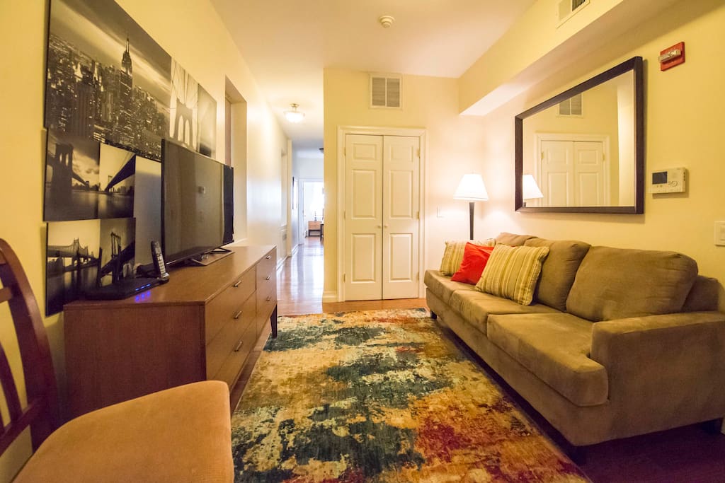 Living room with 50" flat screen TV and full size sleeper sofa
