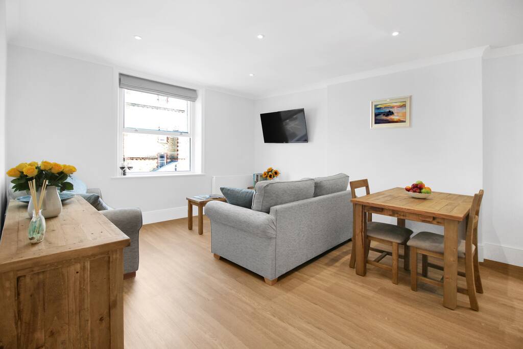 Lounge with view to beach (2 seater sofa bed on the left)