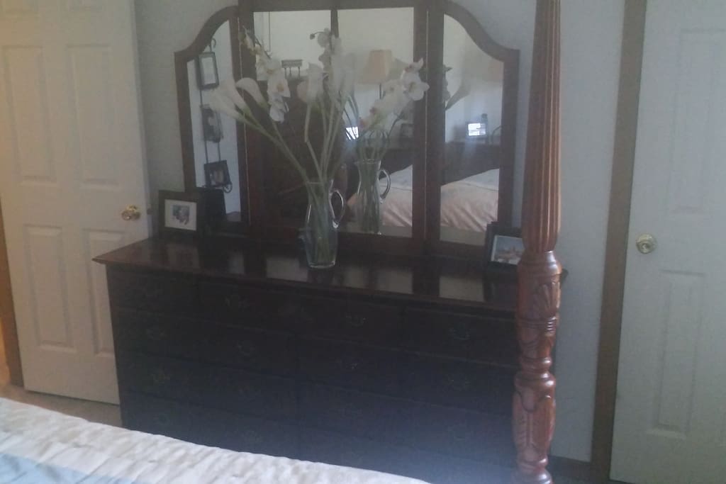 One of the dressers (with mirror) in the bedroom.