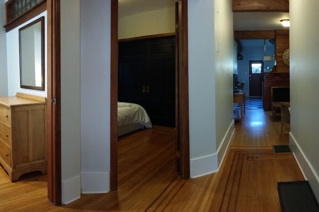 View from entry door. Bedrooms on left with hallway through living room leading to kitchen, back bedroom and bathroom.