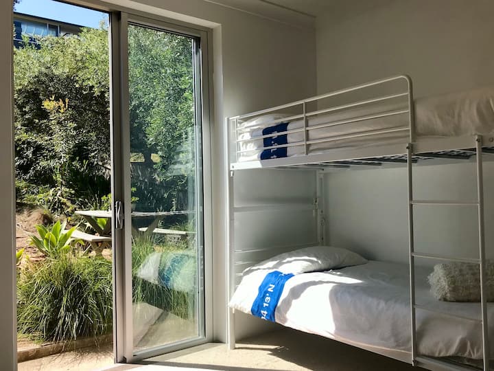 downstairs kids bunk room opening onto back garden