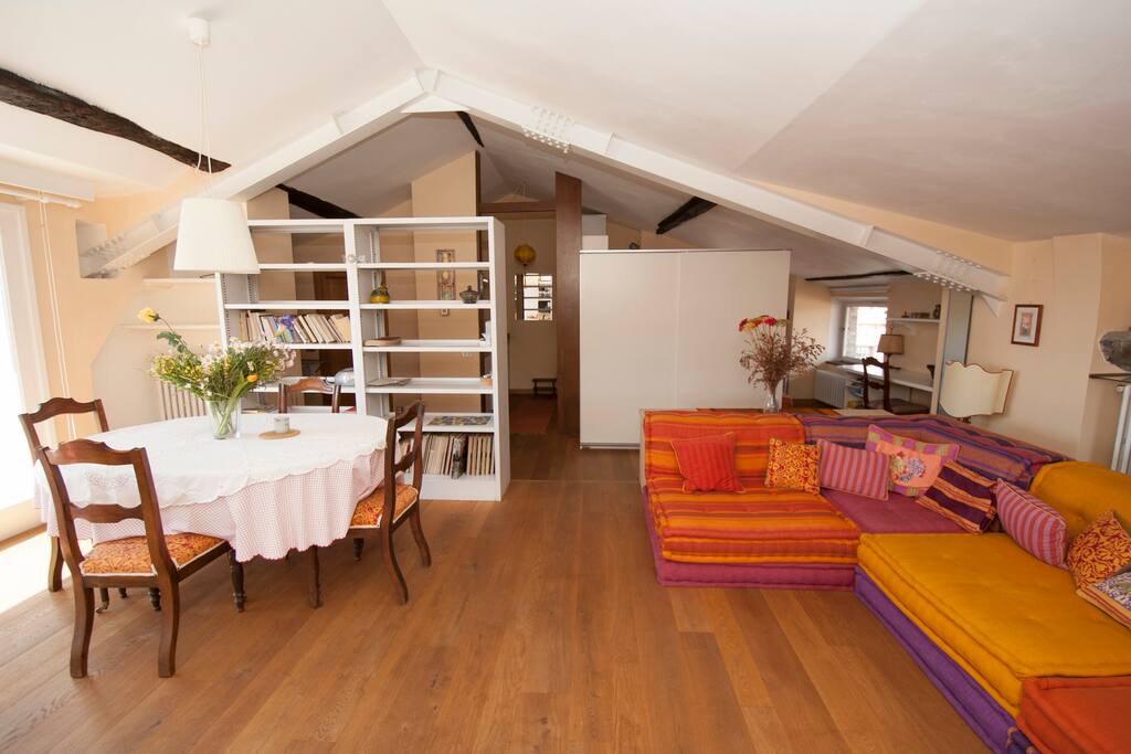 Spacious and beautifully decorated penthouse apartment with wood floor, stunning views from all the windows and comfortable 'Roche-Bobois' sofa. Large dining table facing the private terrace.