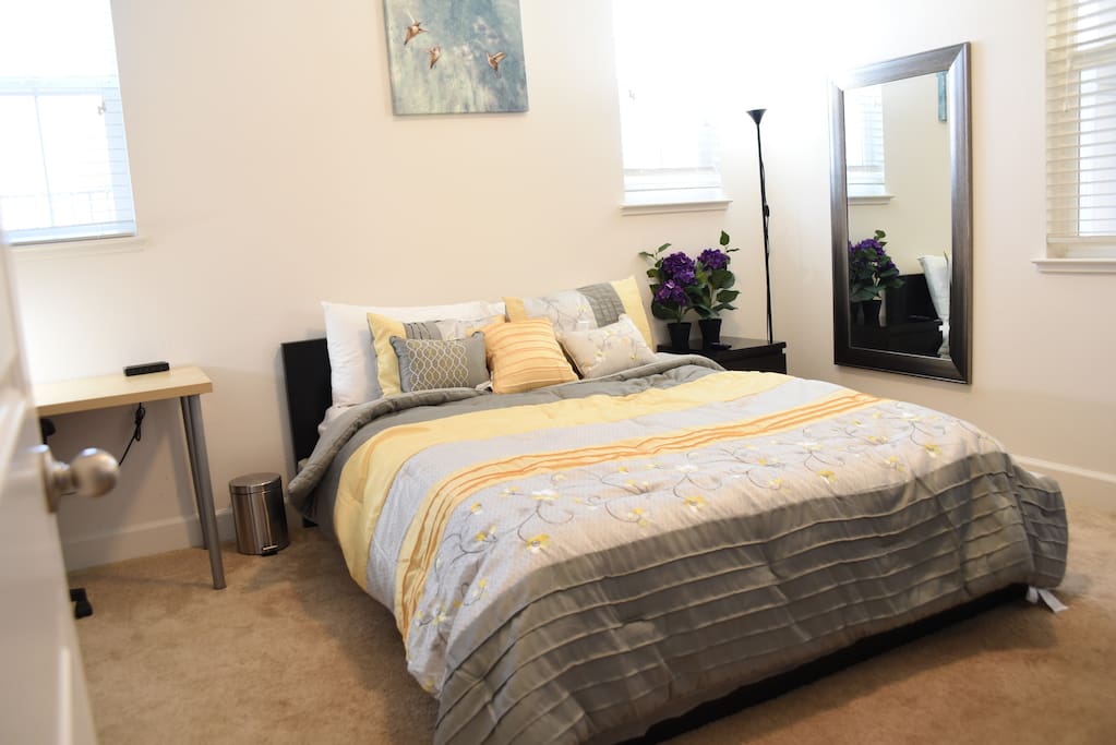 Bedroom with queen bed, working space and private bathroom