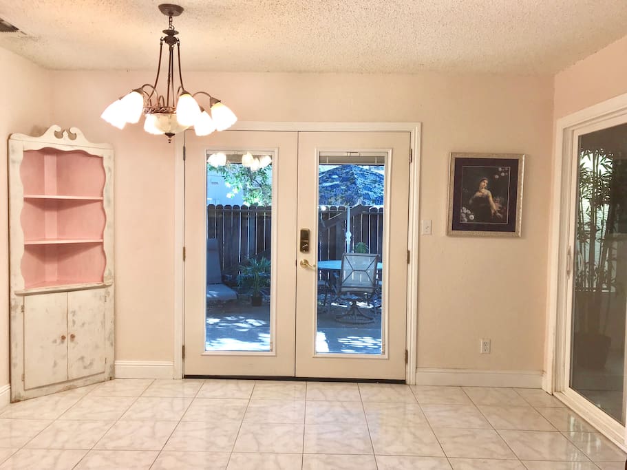 French doors leading to the second patio downstairs from the dining room.