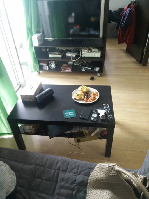 Living room. Couch for 2, 42 inch HD 4K TV with XBox, Not including the eggs n bacon in the picture.
