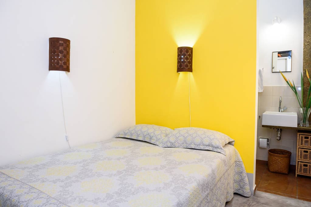 Comfortable bedroom with double bed, ceiling fan, split system aircon, private ensuite bathroom, large wardrobe, full-length mirror, new pillows, 300-threadcount bedsheets, blankets, towels.