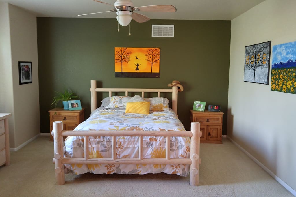 queen size bed in the master bedroom. Beautiful mountain view through the window.