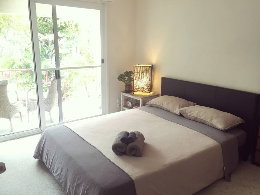 Master bedroom with private balcony and bathroom. Sleep to the sound of the ocean and be the first to check the surf in the morning from your private balcony.