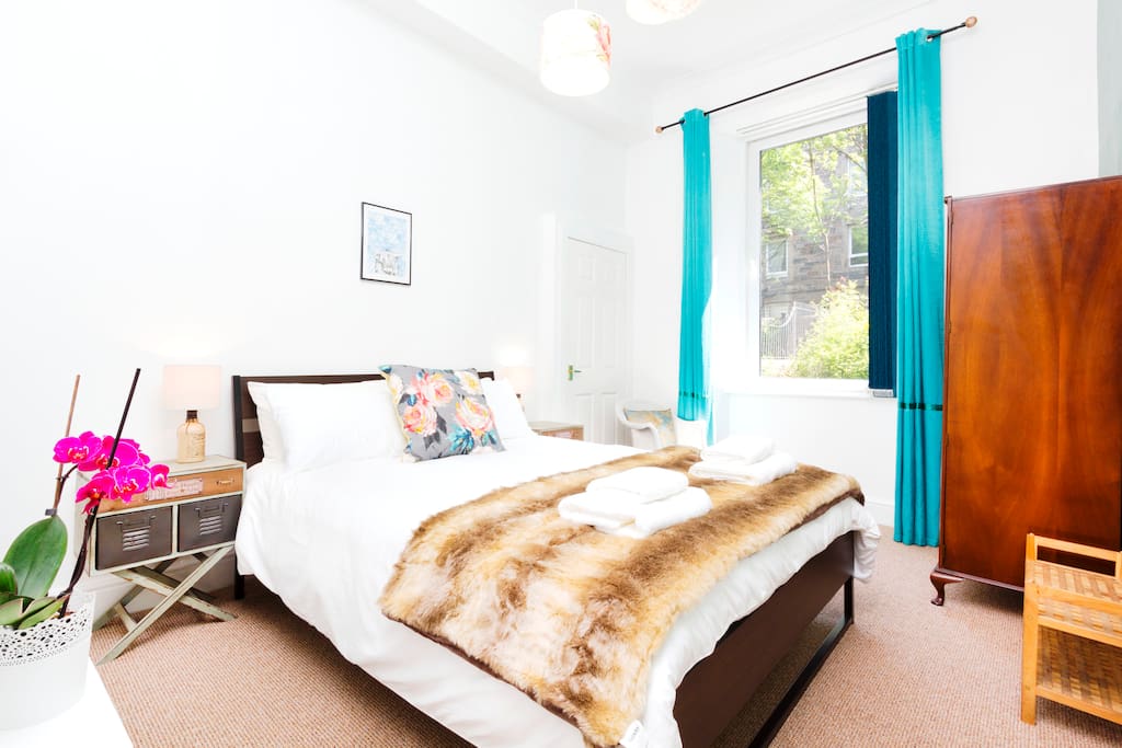 A spacious master bedroom with European King sized bed (6Ft 6 by 5Ft 2)