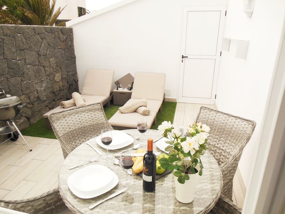 Outside Courtyard with Table, Chairs, Sunloungers and BBQ