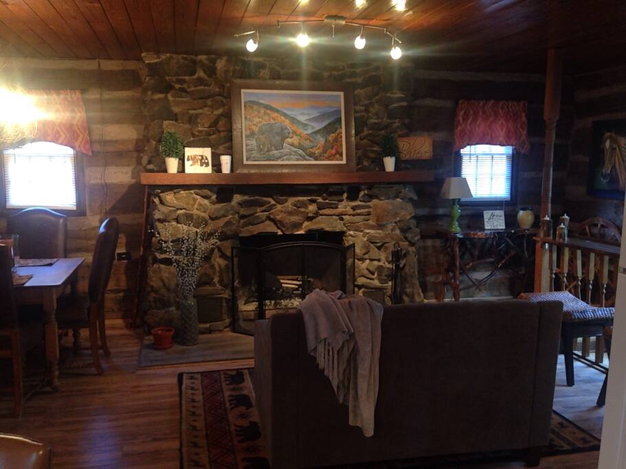 Relax in front of this stunning rock fireplace.