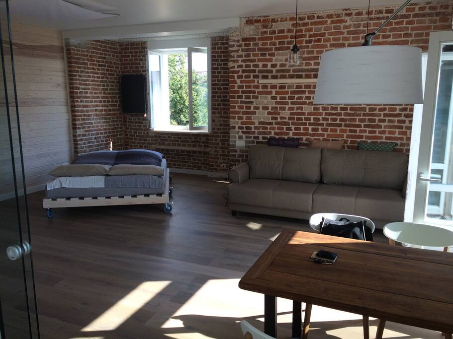 The double-bed (on wheels) can be moved around to wherever you feel comfortable to spend the night