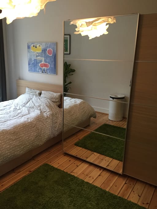Bedroom with 140cmx200cm sized double bed and closet storage