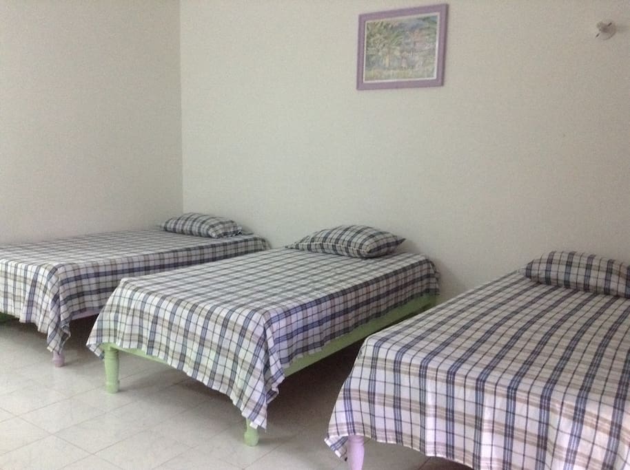 A Standard room with 3 twins: Deluxe has 2 doubles.